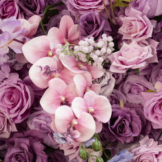Close-up of pink and purple flowers with a butterfly.