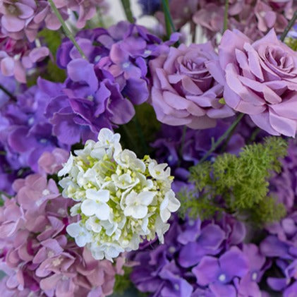 Vibrant colors give the purple hanging flower set detailed realism and beauty.