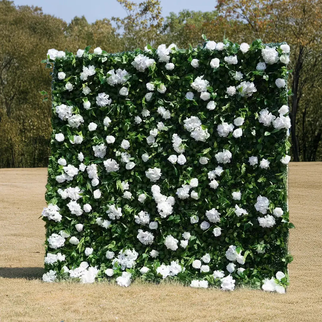 Artificial green wall backdrop with white flowers in an outdoor setting