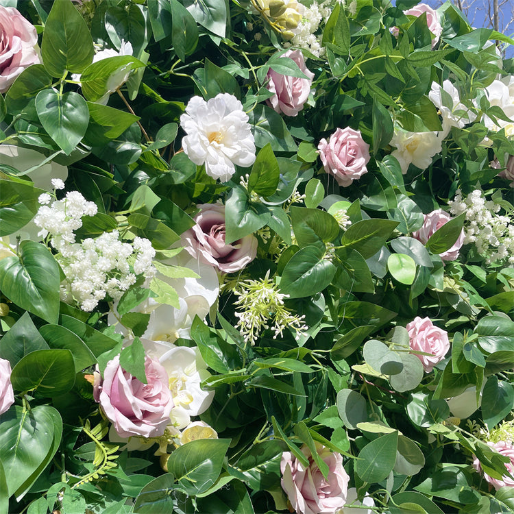 Vibrant colors give the green leaves and pink rose flower wall detailed realism and beauty.