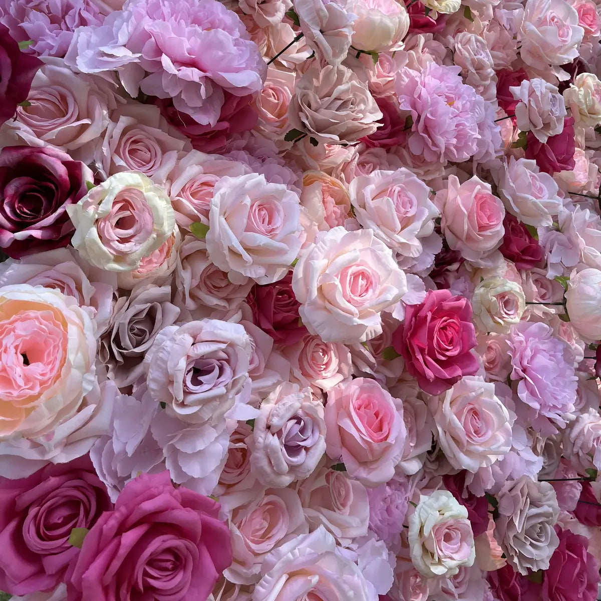 The colorful pink flower wall detailed view highlights its vibrant, realistic shapes and fabric backing.