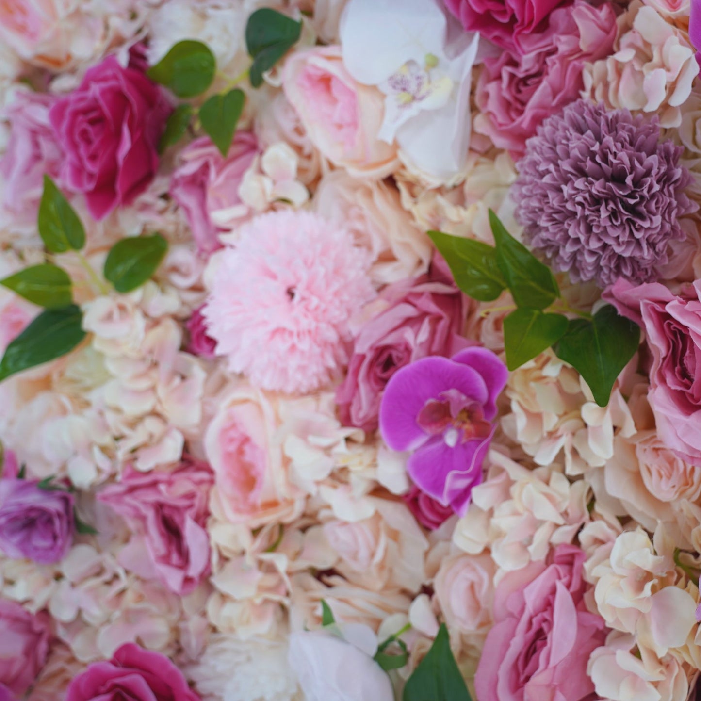 The rose pink fabric artificial flower wall looks gentle and lovely.