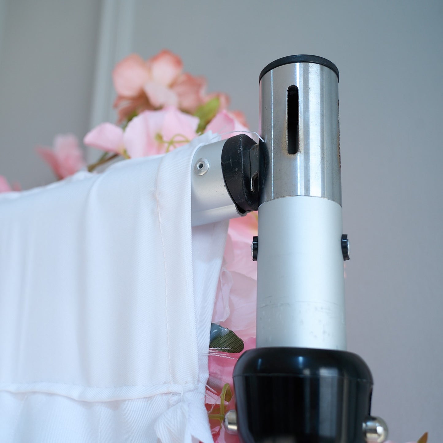 The pink roses flower wall is fixed to a shelf.