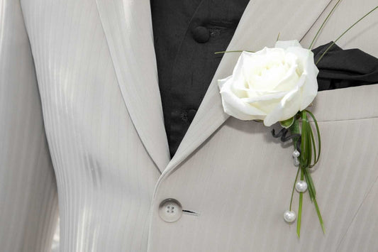 A corsage in a man's breast pocket