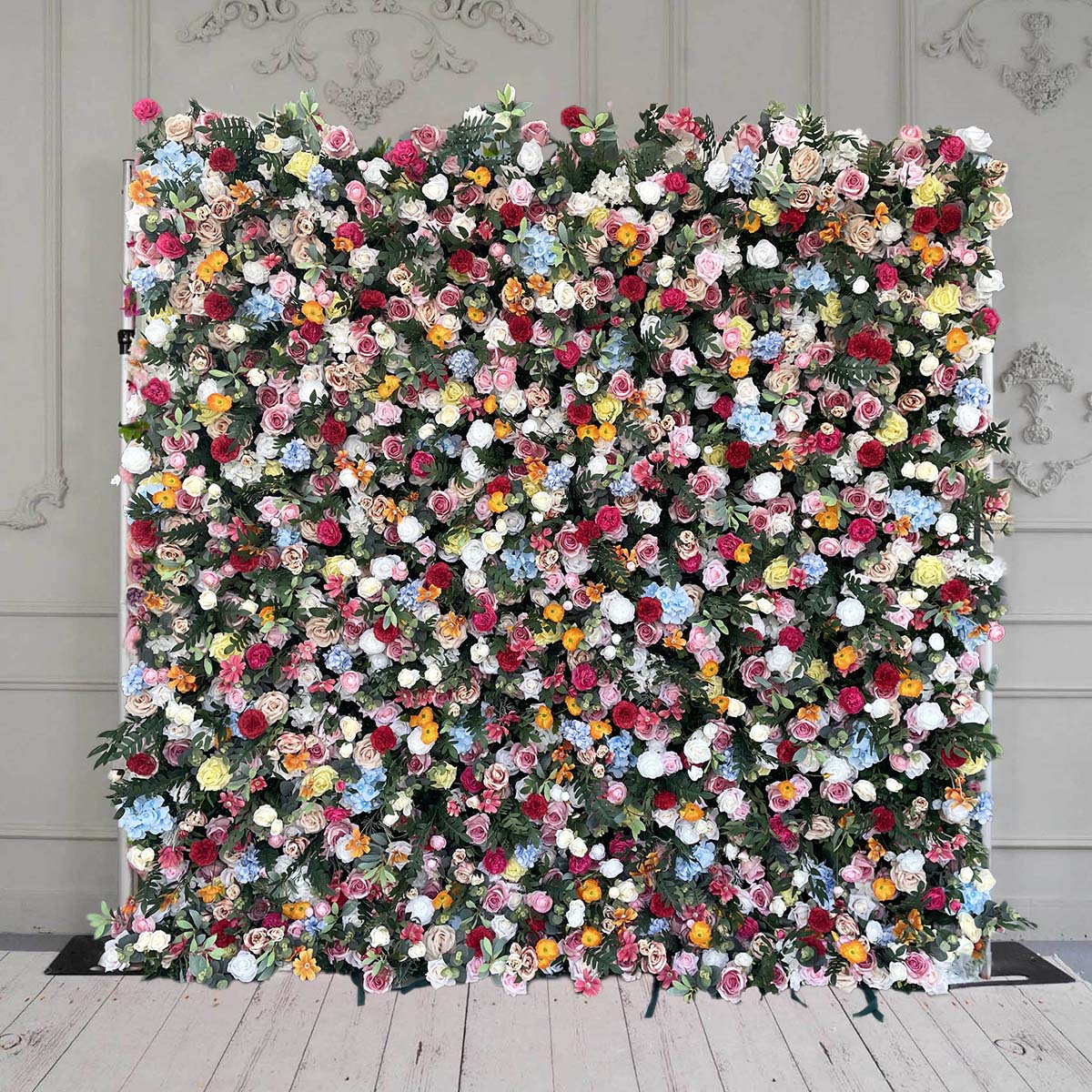 The colorful rose & green leaves flower wall features a fabric backing, ensuring lifelike shapes and vibrant colors.