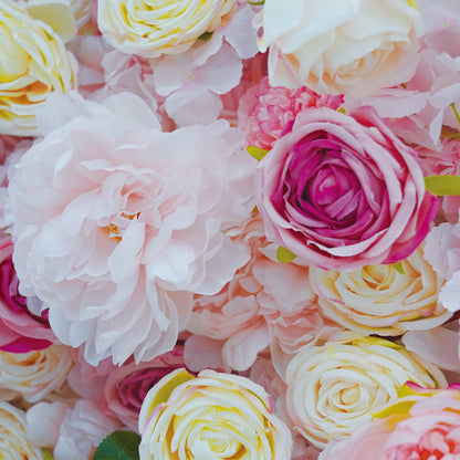 Close-up of a bouquet of pink, white, and yellow roses.