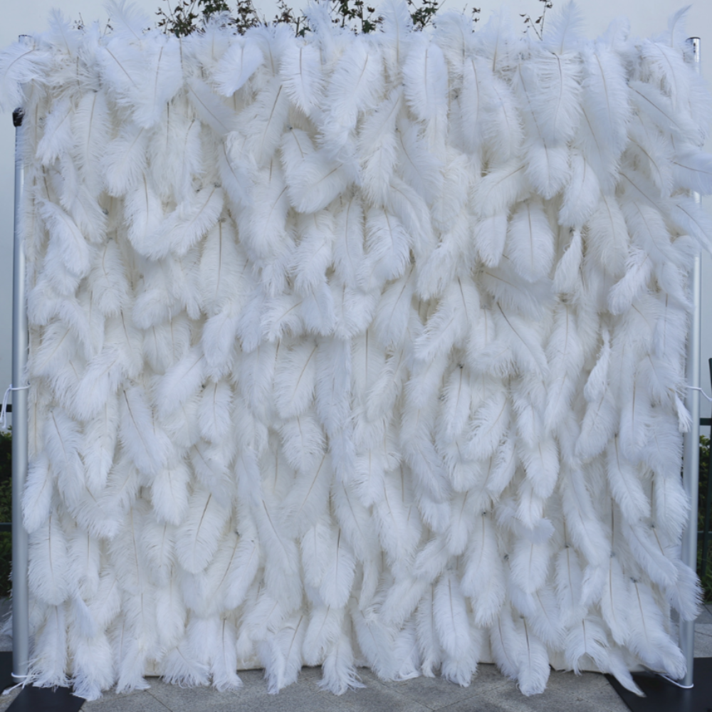 The white ostrich feather flower wall looks pure and elegant.