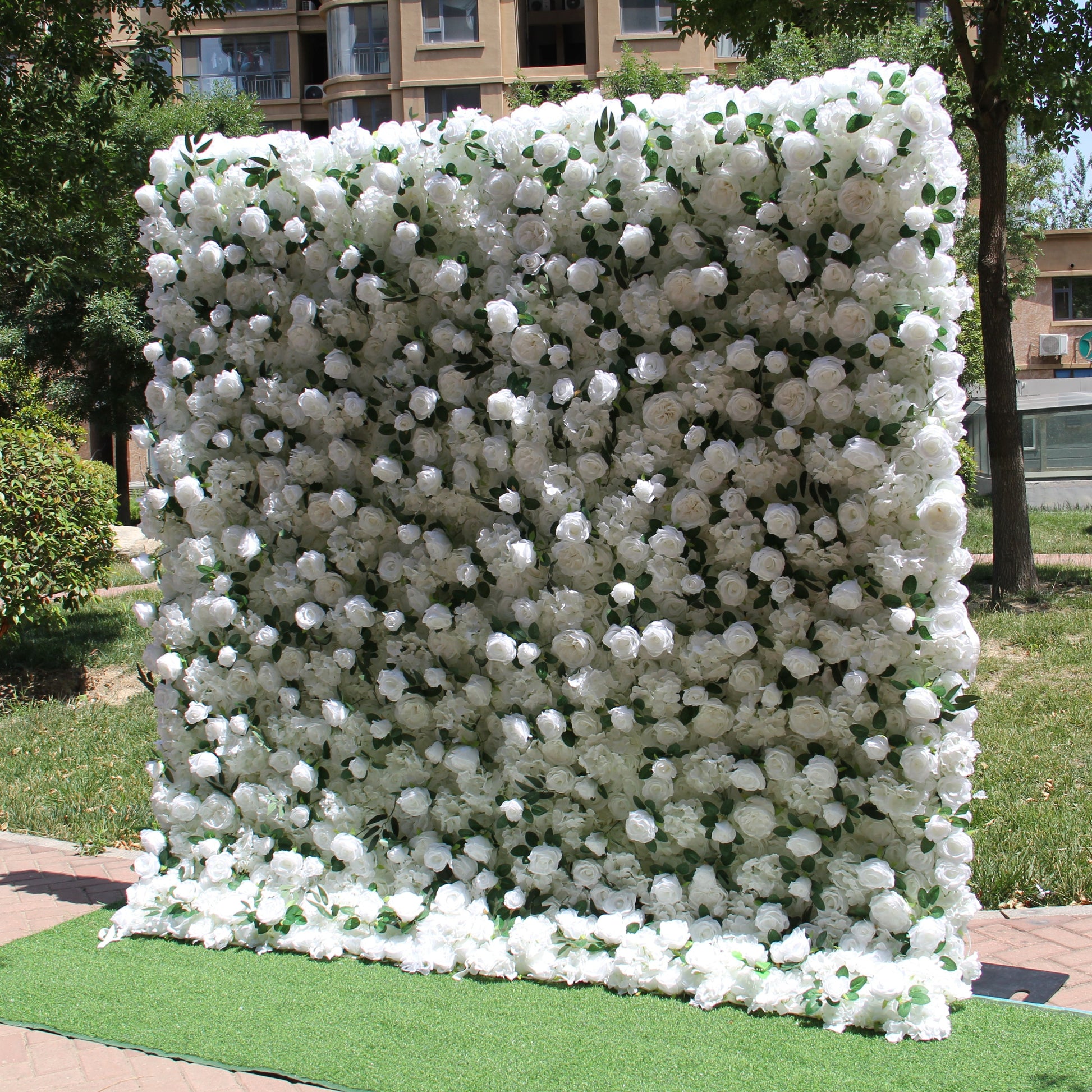 The white peony & green rose flower wall side view is designed for realism and durability with a fabric backing.