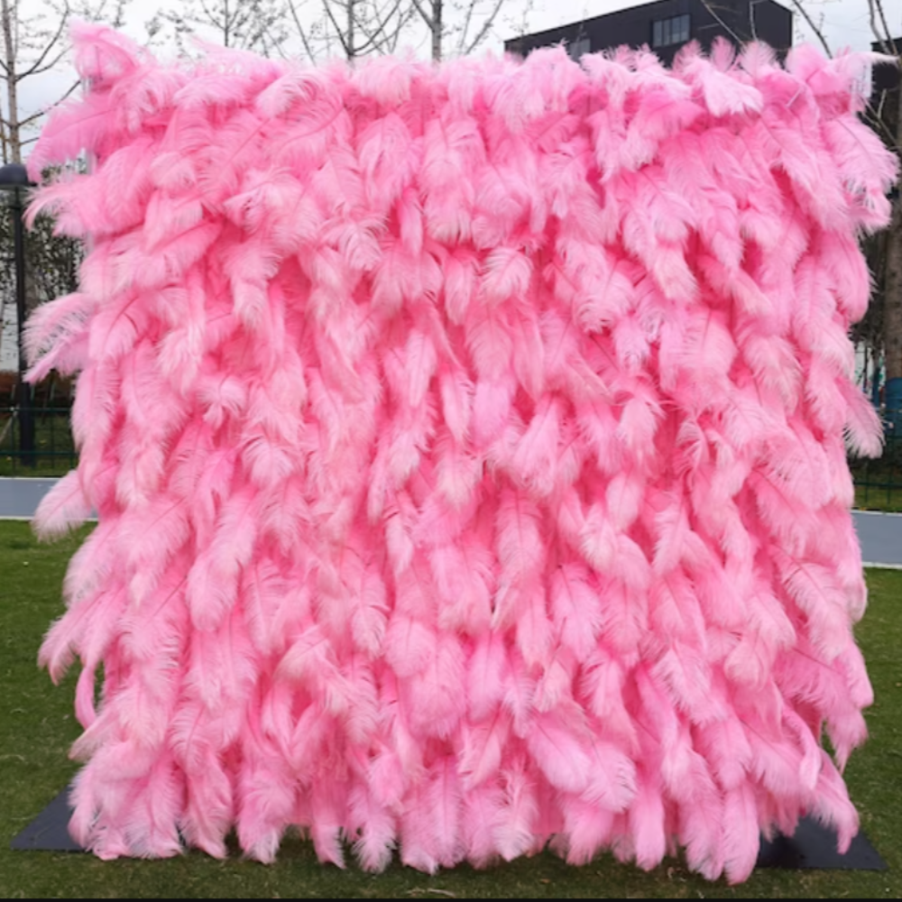 Pink ostrich feather fabric flower wall looks cute and innocent.