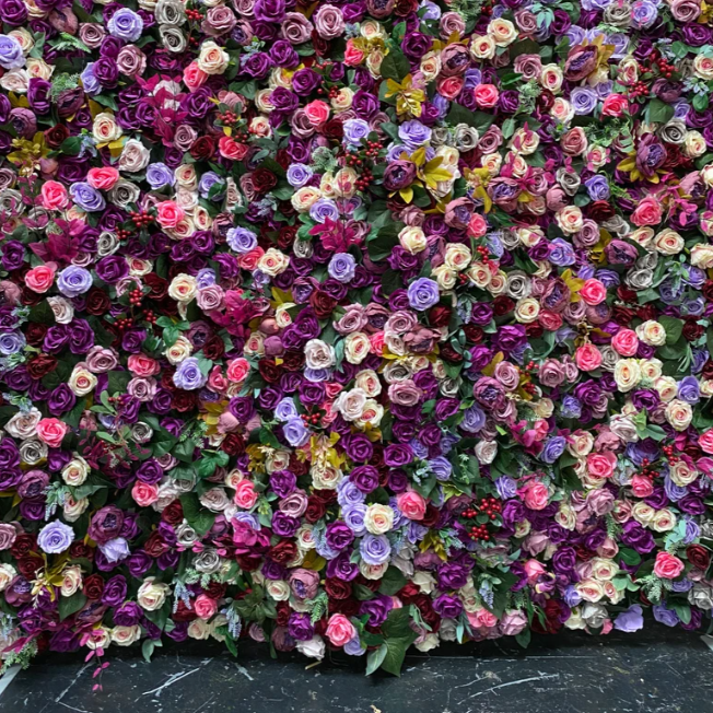 The purple rainbow fabric flower wall presents a colorful and splendid atmosphere.