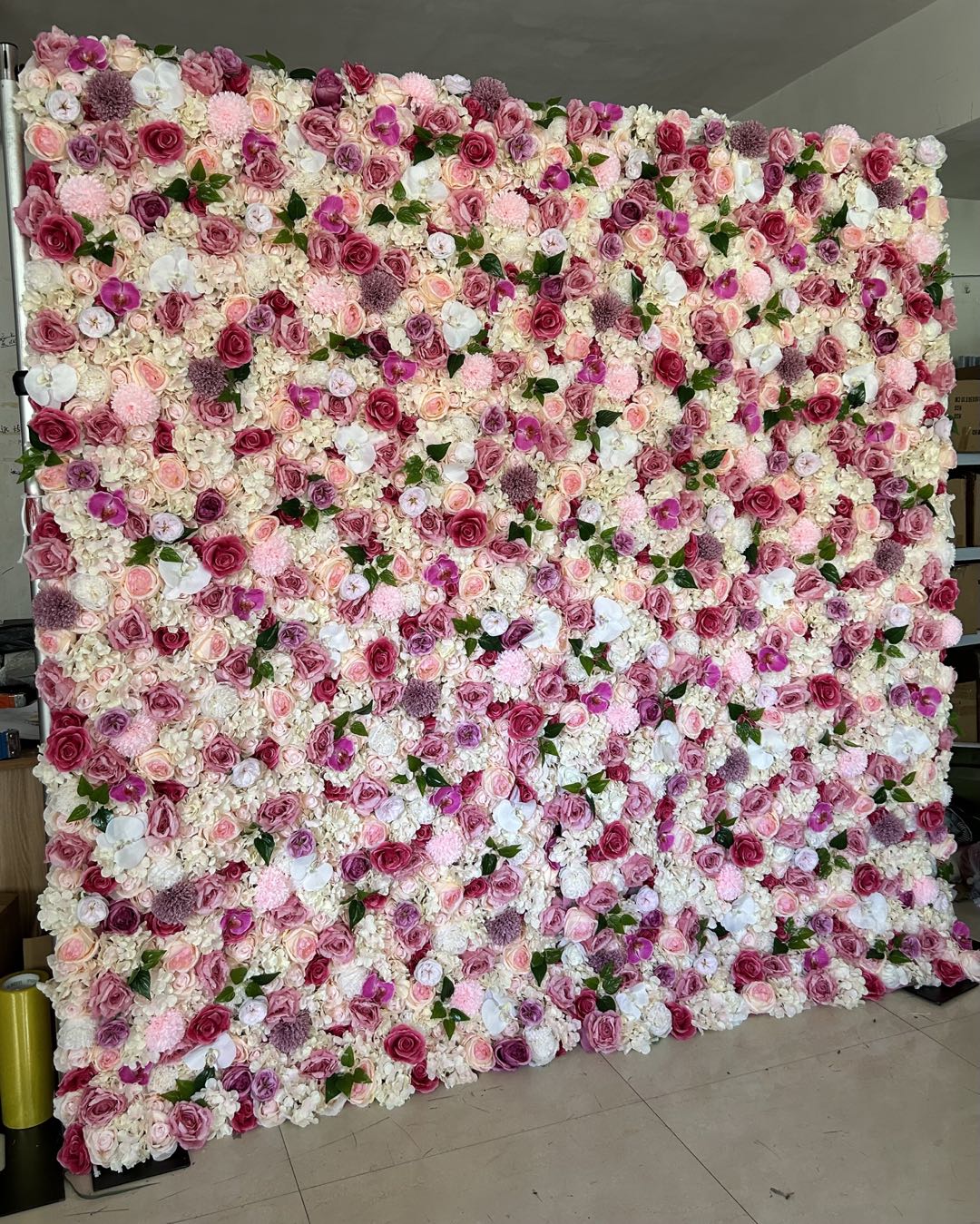 The rose pink fabric artificial flower wall looks gentle and lovely.