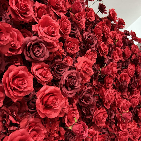 The heart shaped red rose flower wall looks vivid and lifelike.