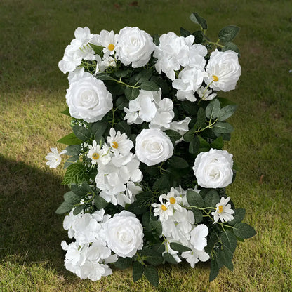 White wedding flower wall on the ground.