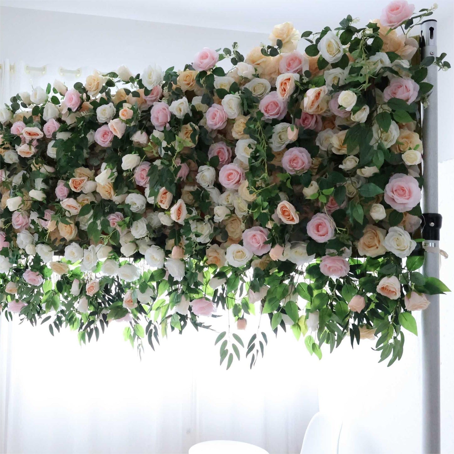 The green pink florals backdrop is full of atmosphere.