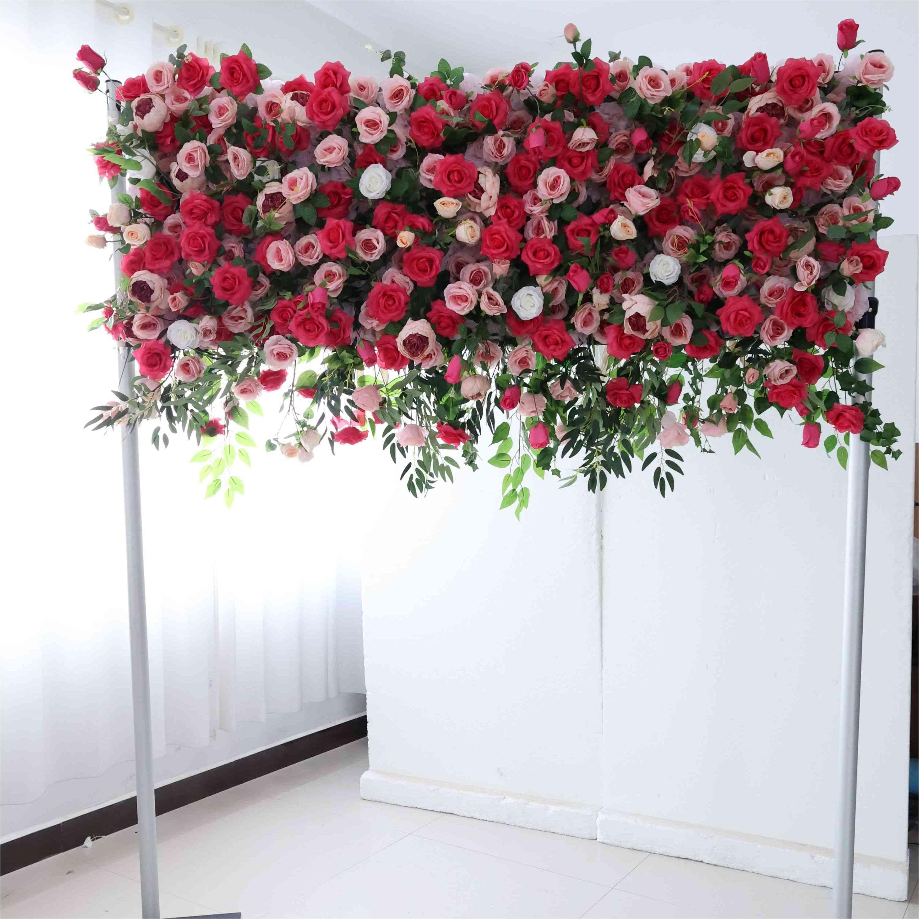 The pink red florals backdrop looks warm and romantic.