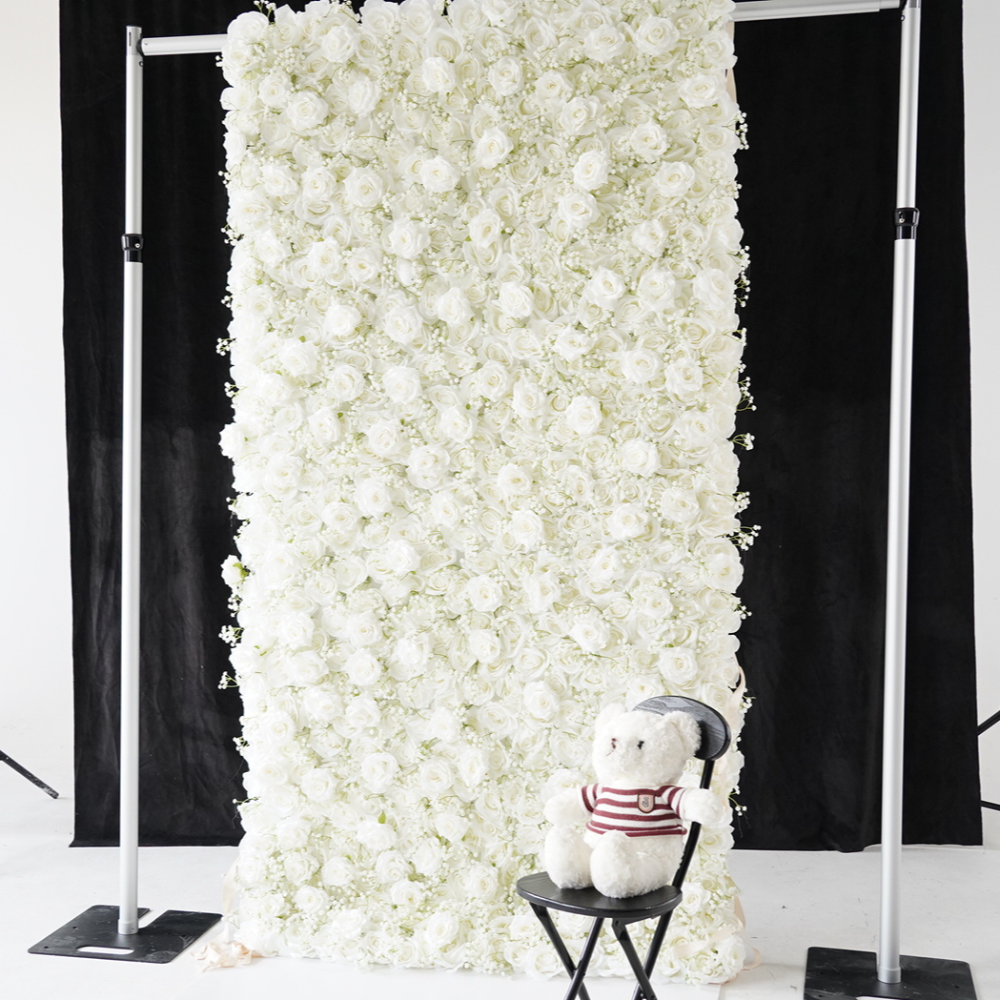 Placing a white bear in front of the baby breath pure white rose fabric flower wall.