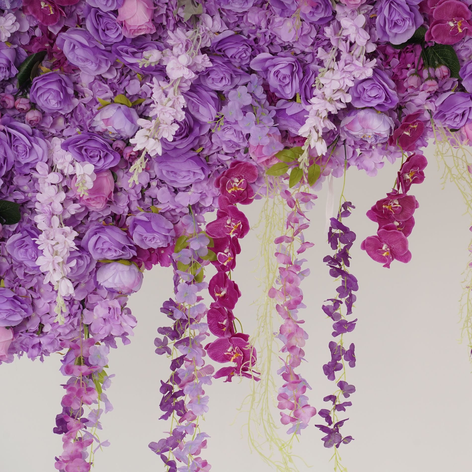 The purple flower wall's detailed view shows off vivid colors and a realistic fabric backing.