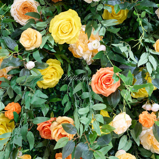 Balloon decor complements yellow green flower wall, offering a beautiful and festive backdrop.