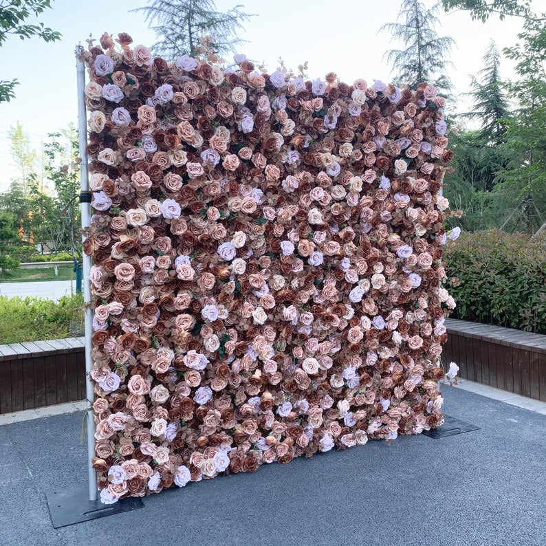 The coffee champagne flower wall backdrop looks romantic.