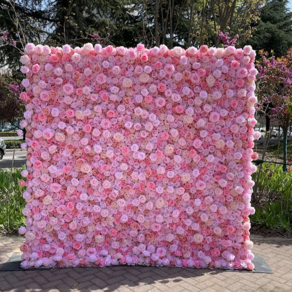 The pink rose fabric flower wall presents a romantic atmosphere.